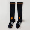 Pair of black knee high socks with orange stripes and silver accents for graduated compression.