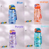 A set of five dinosaur silicone straw water bottles in blue, orange, purple, and green.