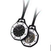 A black and white pocket watch pendant with leather straps and an octagonal face.