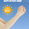 A hand wearing a light beige ice silk arm sleeve is shown against a blue sky, emphasizing UV protection.