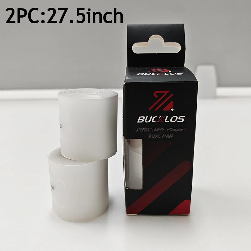 A box containing two bicycle puncture protection liners, one white tube and one cylindrical piece.