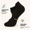 Black silicone yoga pilates socks showing an open instep design and arch support feature