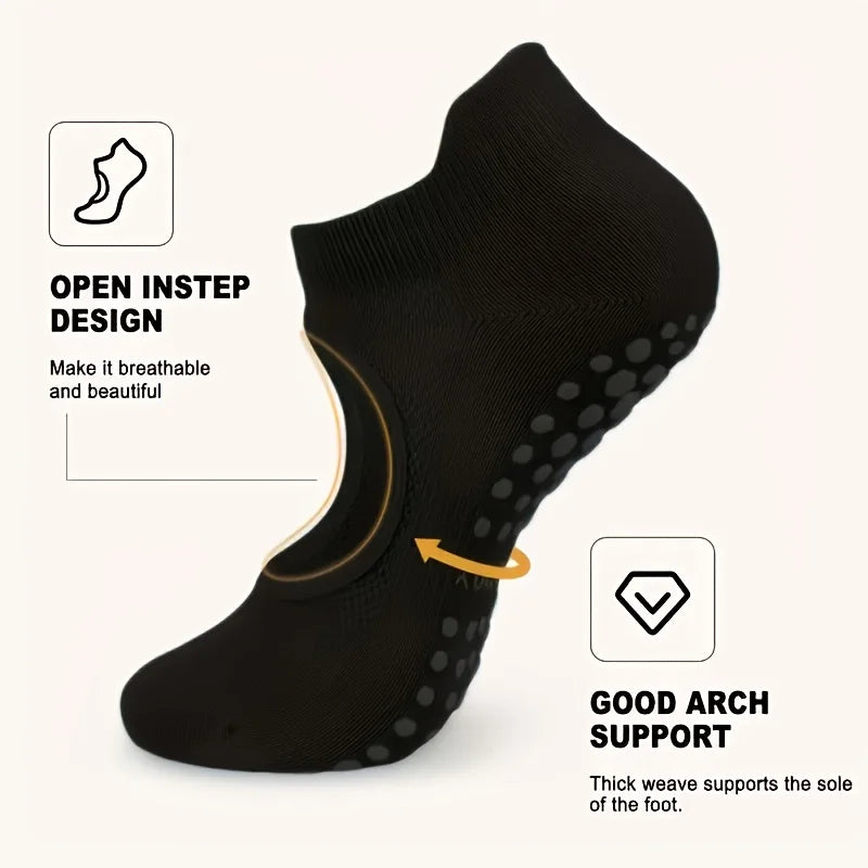 Black silicone yoga pilates socks showing an open instep design and arch support feature