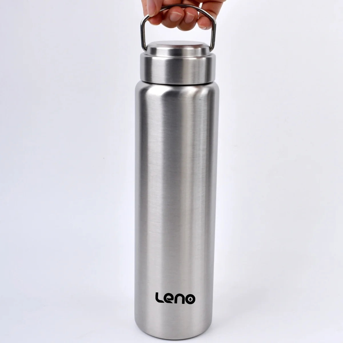 A silver stainless steel water bottle with a hinged lid is held by a hand.