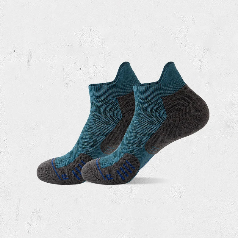 A pair of dark teal and black compression socks for marathon running.