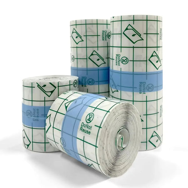 Rolls of waterproof film dressing for tattoo aftercare in green and blue packaging