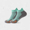A pair of teal and gray compression socks for marathon running, shown from the side.