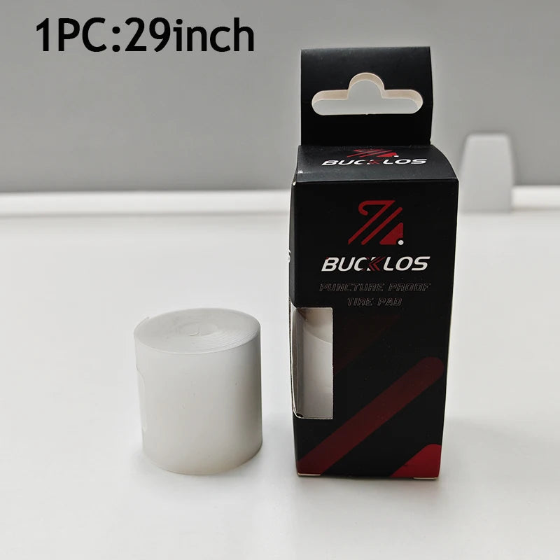 A box of bicycle puncture protection liner with a 29-inch size and a roll of white protective material.