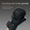 A close-up of a black thickened matte PU leather boxing training glove being held by a hand.