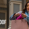 A woman holds a pink leak-proof insulated water bottle in a denim jacket, demonstrating its portability.
