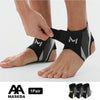 A pair of black and gray ankle compression straps being applied to a person's foot.