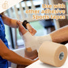 A person applies pre-wrap athletic foam tape to a foot for joint protection, demonstrating its use with other sports tapes.