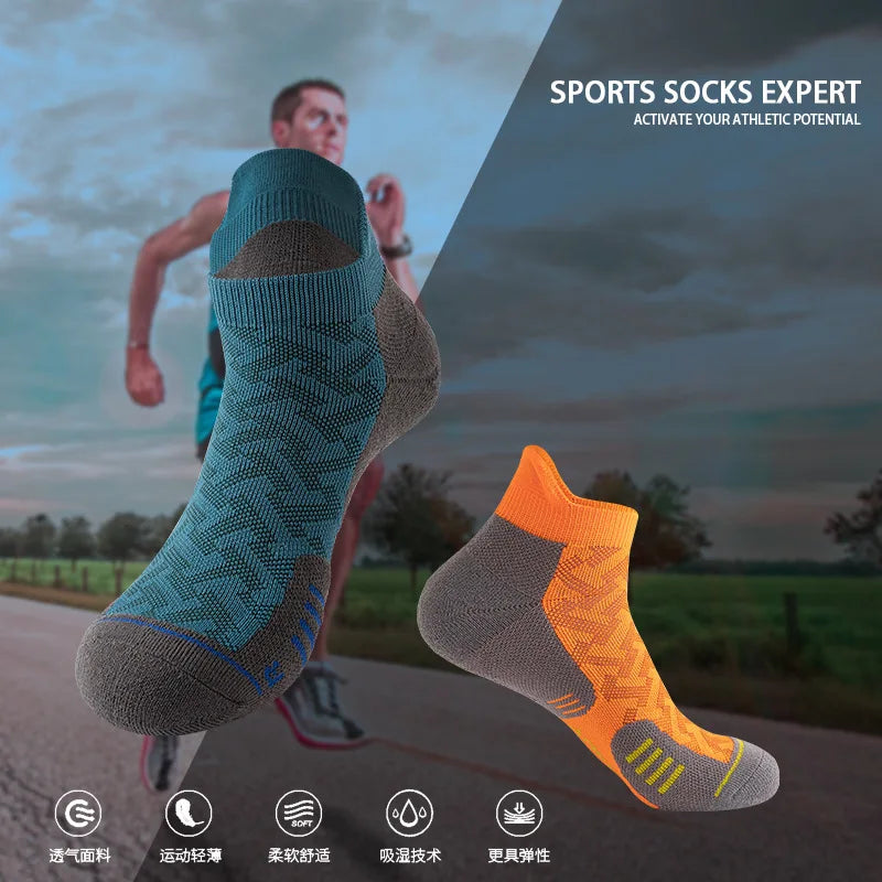 A pair of orange and gray sports socks are displayed against a blurred outdoor background, emphasizing athletic performance.