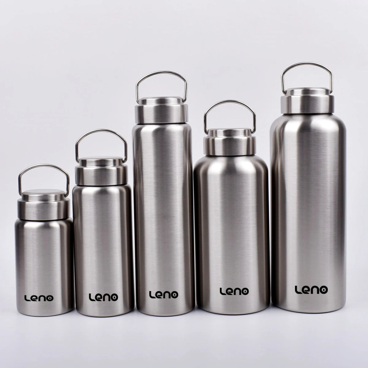 A row of four metallic silver sports water bottles with hinged lids standing side by side.
