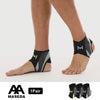 A pair of black and gray adjustable ankle compression straps worn on a person's foot.