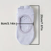 White silicone yoga pilates socks with an oval opening and ribbed texture