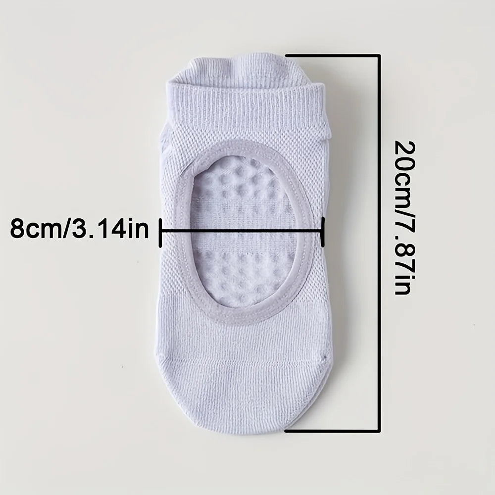 White silicone yoga pilates socks with an oval opening and ribbed texture