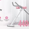 A silver adjustable core abdominal trainer with pink accents is shown on a white background.