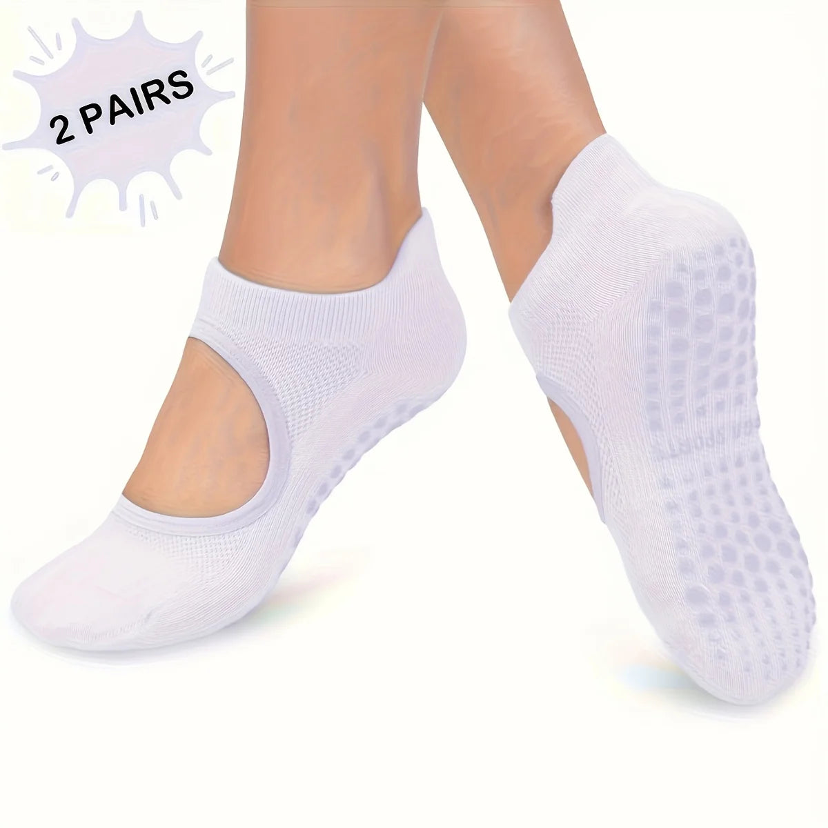 Two pairs of white silicone yoga pilates socks shown on a person's feet.