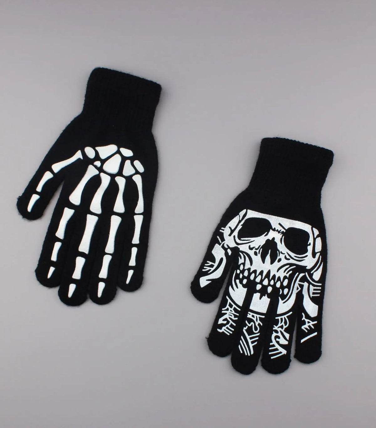 Black gloves featuring a white skeleton design on the palm and back of the hand.