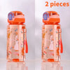 Two clear silicone straw water bottles with rabbit designs in orange and pink colors
