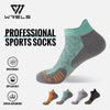 A set of professional sports socks in various colors and styles, demonstrating breathable and shock-absorbing features.