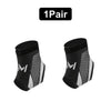 A pair of black ankle compression straps with a mesh pattern and white accents.