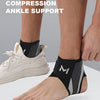 A person's ankle is supported by a black compression strap designed for ankle support.