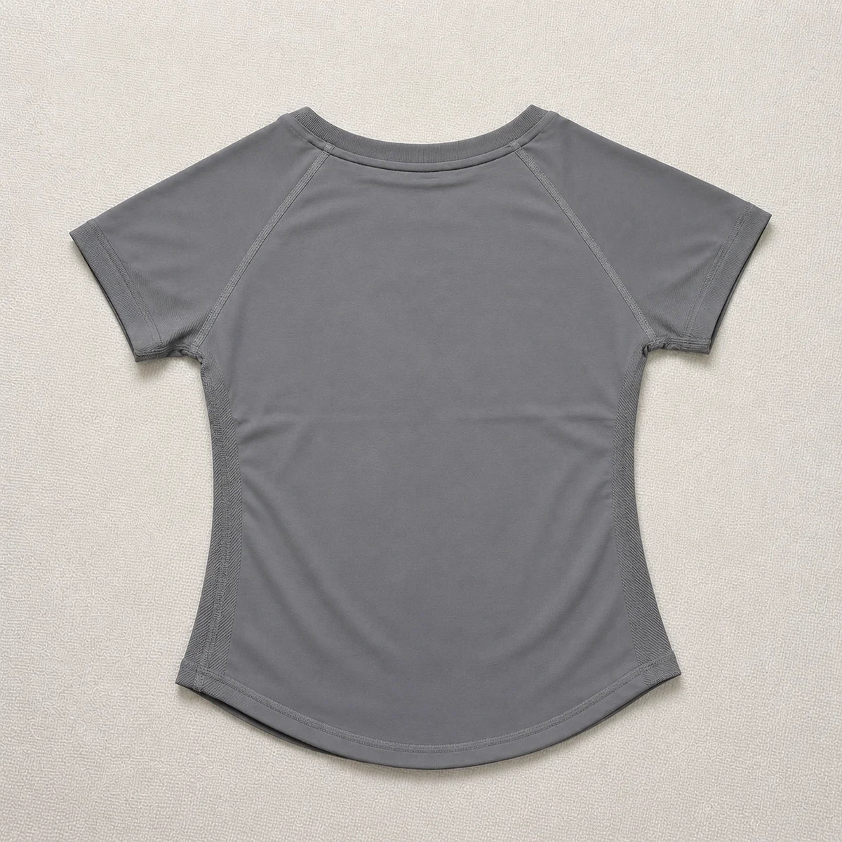 A plain gray seamless t-shirt top for women.