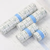 Rolls of waterproof film dressing for tattoo aftercare in white and light blue packaging