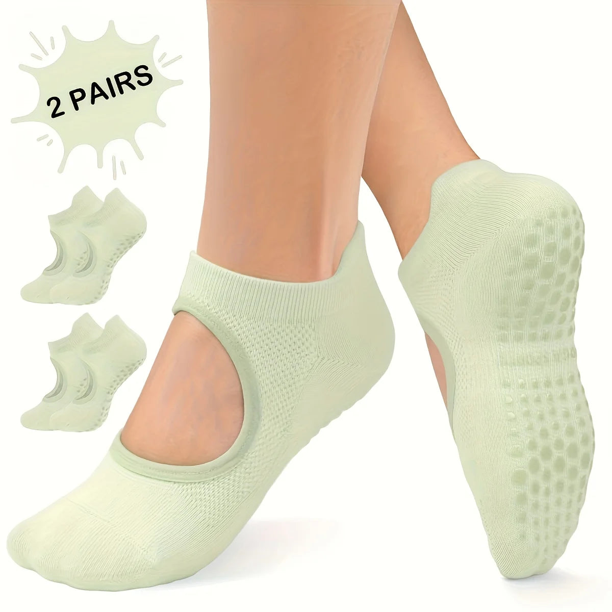 Two pairs of light green silicone yoga pilates socks shown on a person's feet.
