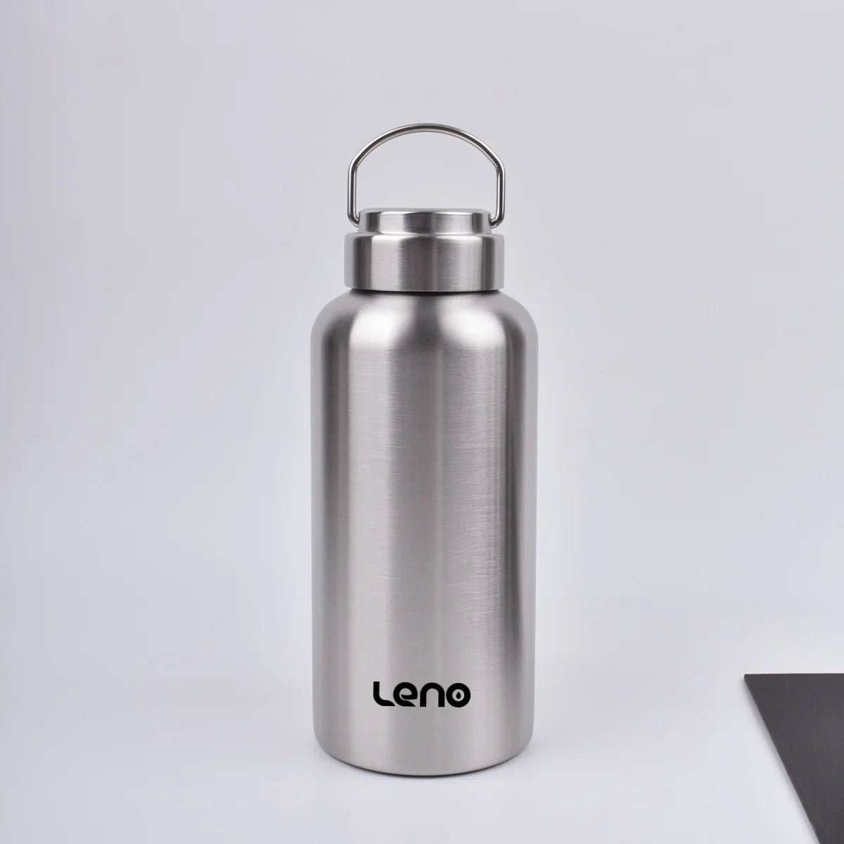 A silver stainless steel water bottle with a hinged cap is shown against a light gray background.