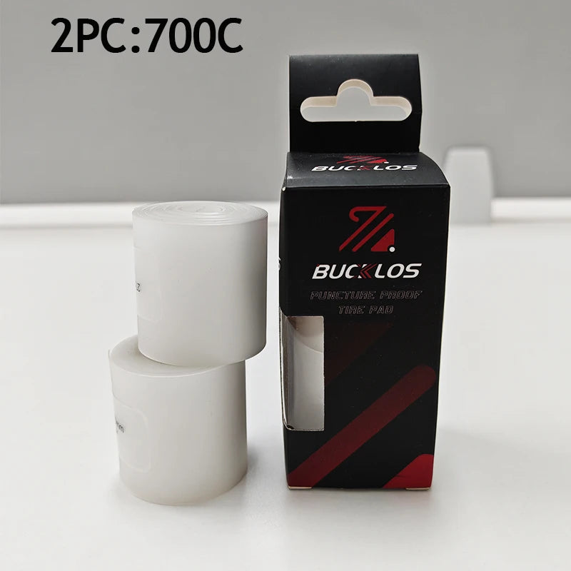 Two packs of Bicycle Puncture Protection Liners in black boxes and white liners.
