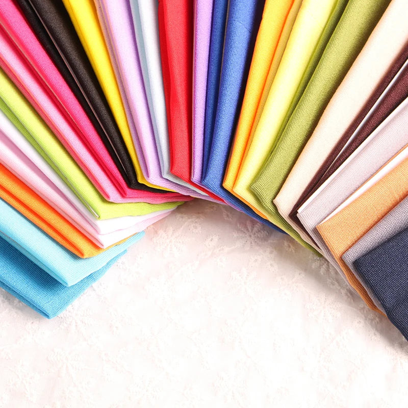 A colorful stack of multi-use elastic headbands in various shades of pink, purple, blue, green, and yellow.