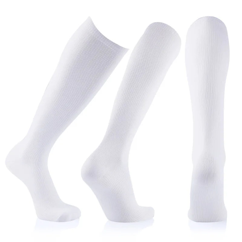Three white compression socks displayed individually against a white background.