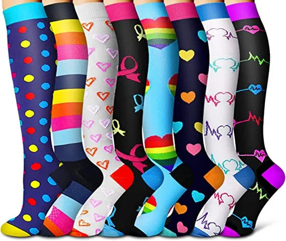 A collection of colorful compression elastic socks featuring various stripes, hearts, and rainbow colors.