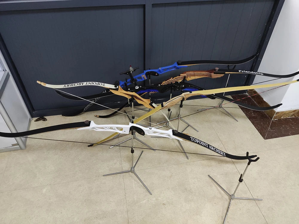 A display of several lighted arrow nocks and arrows for archery, including blue and yellow sets.