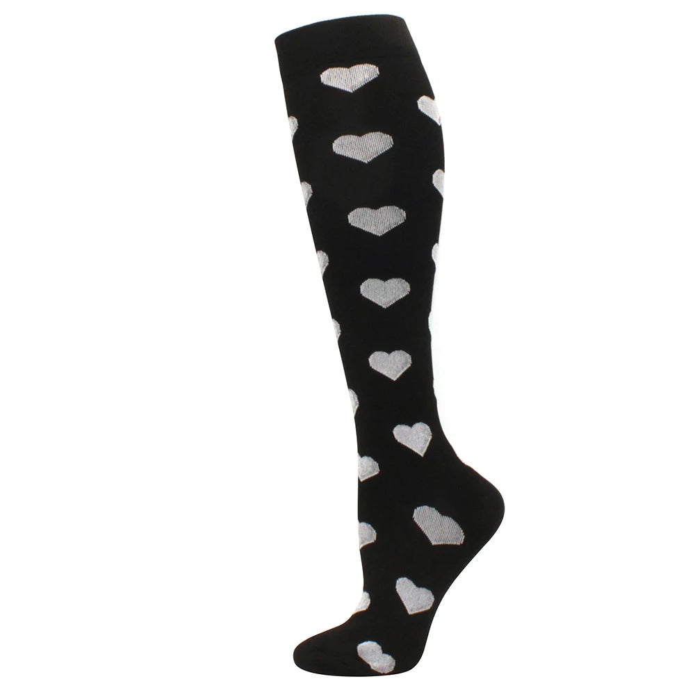 Black compression socks with white heart patterns for circulation and vein support