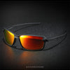 A pair of orange-tinted polarized sunglasses resting on a dark, textured surface.