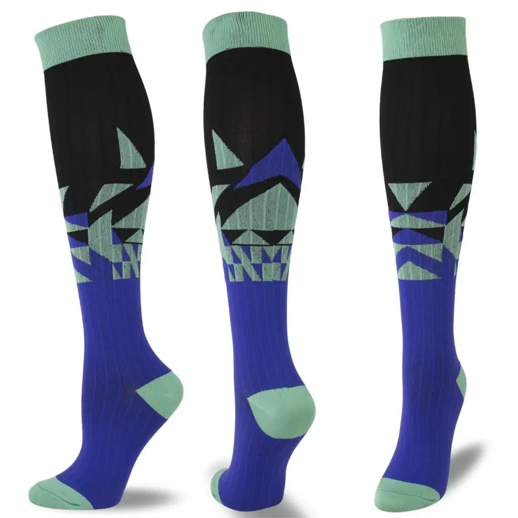 A set of multi-color compression socks featuring geometric patterns in shades of black, blue, and green.