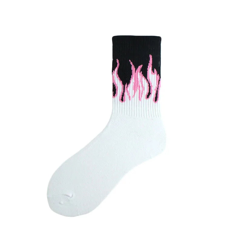 A pair of white crew socks with a black cuff featuring a pink flame pattern.