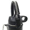 A black paracord strap is wrapped around a water bottle, used for hiking and travel.