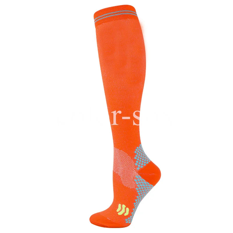 Orange graduated compression socks with a textured pattern and yellow accents