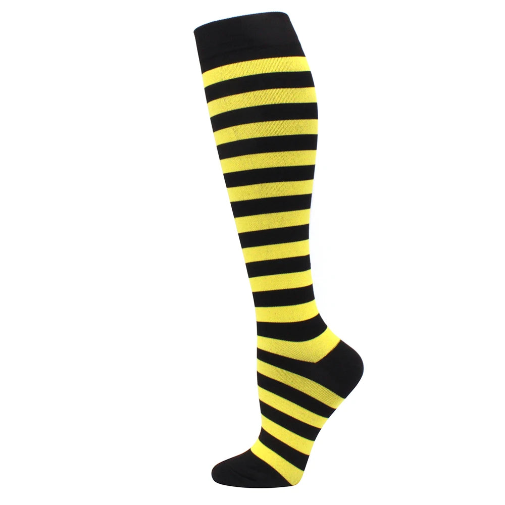 Black and yellow striped medical grade compression socks for circulation and vein support