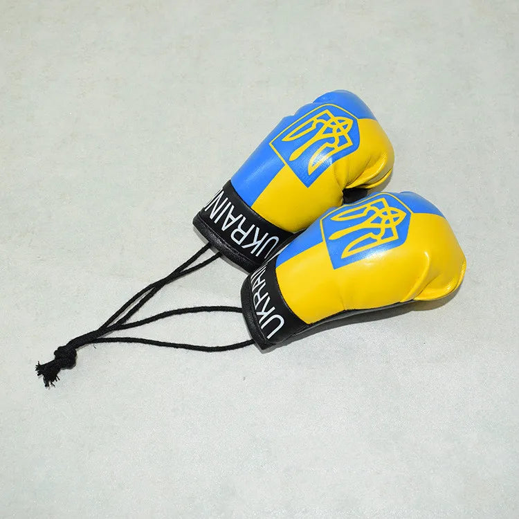 Llavero de guante de boxeo decorativo amarillo y azul con el emblema nacional ucraniano.
