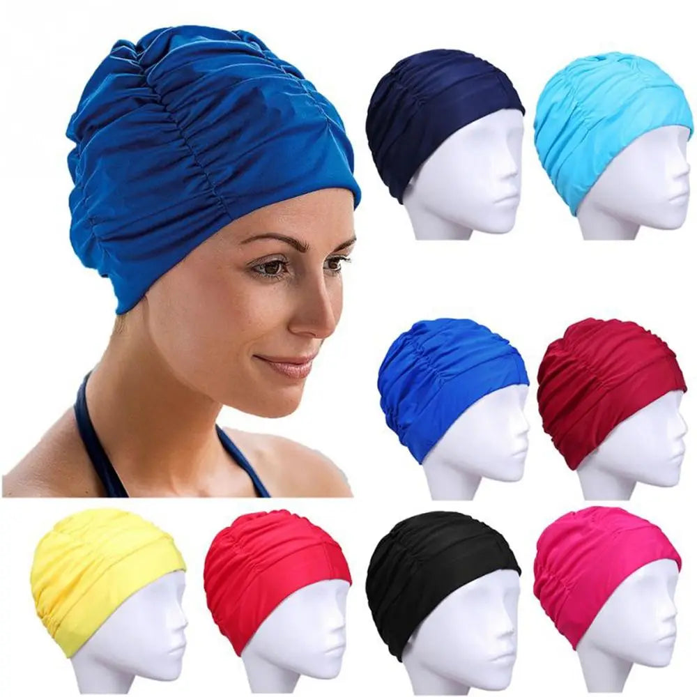 A collection of elastic nylon turban swimming caps in blue, navy, red, pink, and yellow shown on a mannequin head.