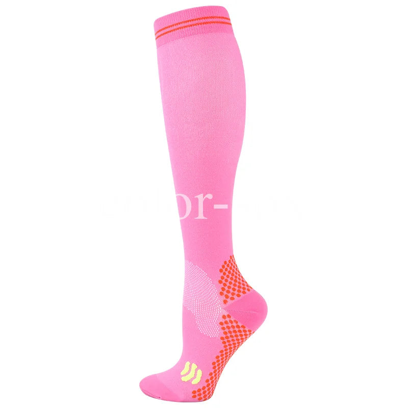 A bright pink graduated compression sock with a textured pattern on the foot.