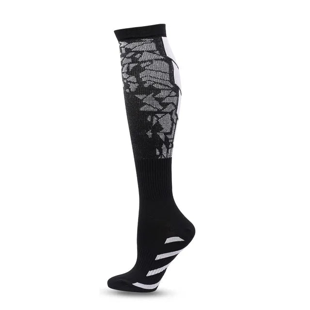 Black graduated compression socks with white stripes on the foot
