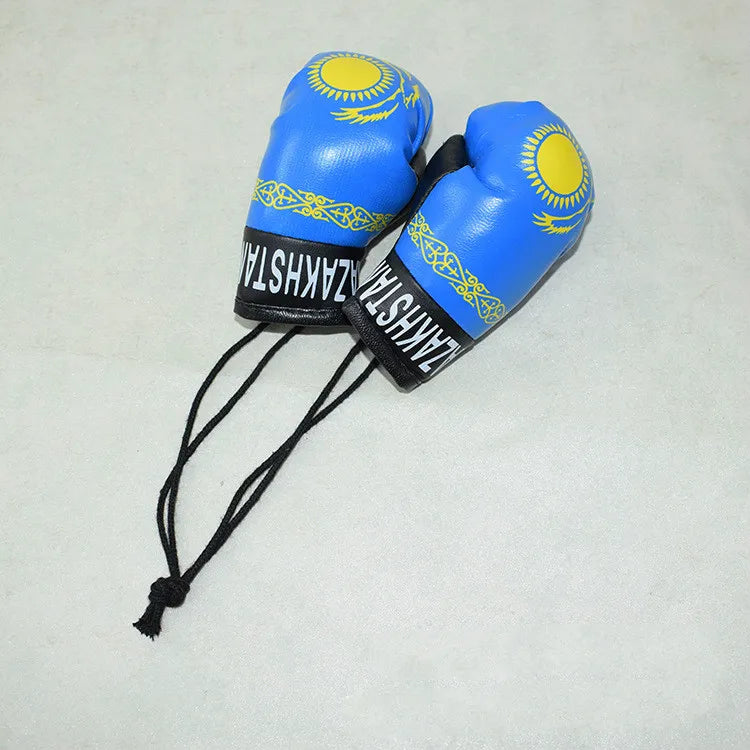 Llavero de guante de boxeo azul con diseño de sol amarillo y texto negro