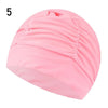 Pink elastic nylon turban swimming cap shown from the side.
